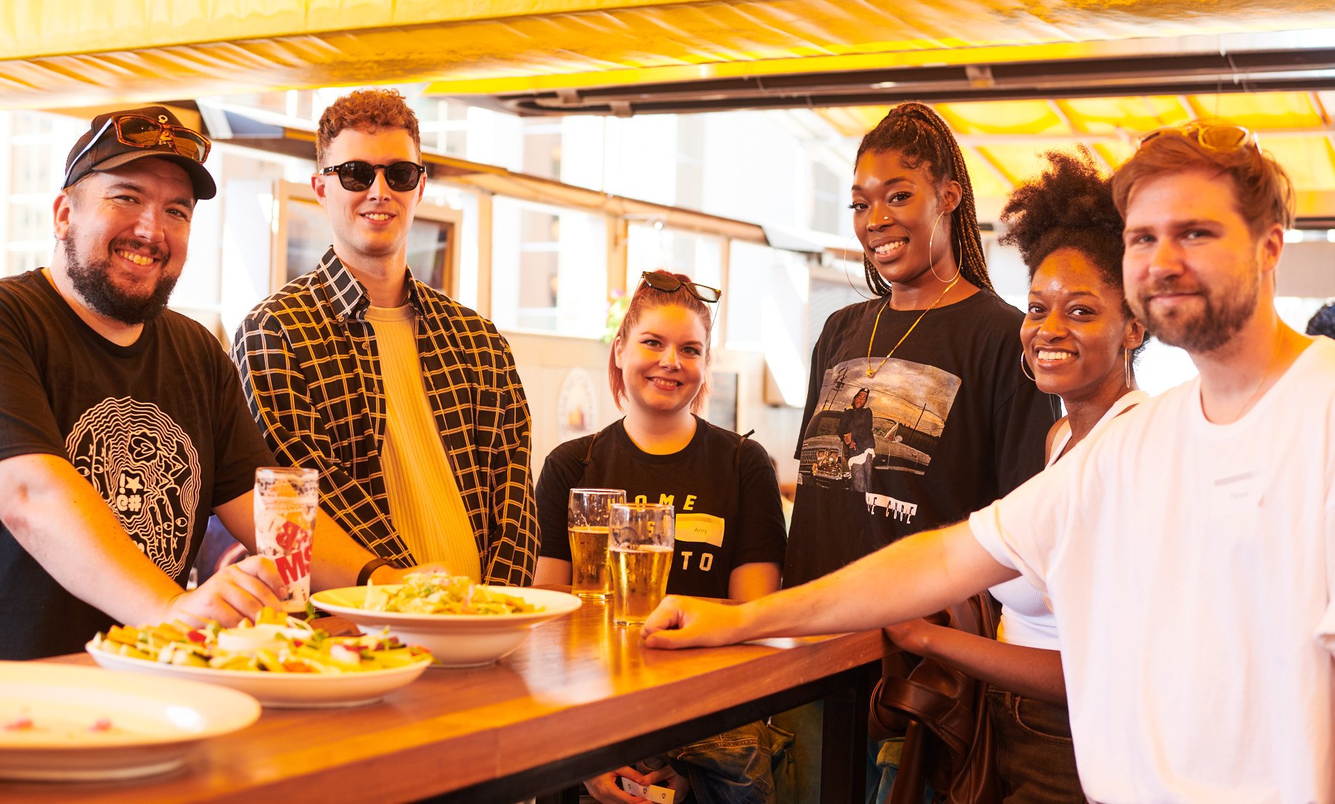 LyricFind employees posing in a restaurant