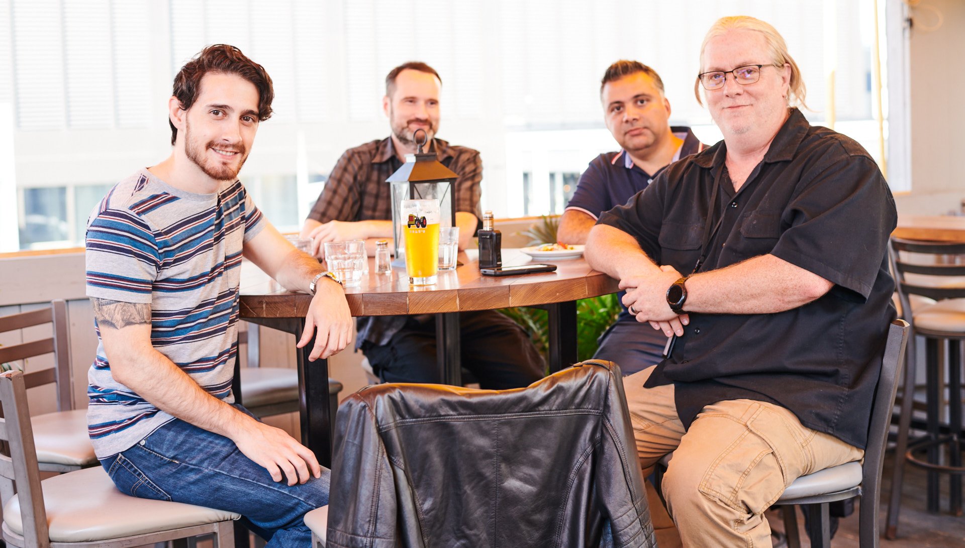 LyricFind employees posing in a restaurant