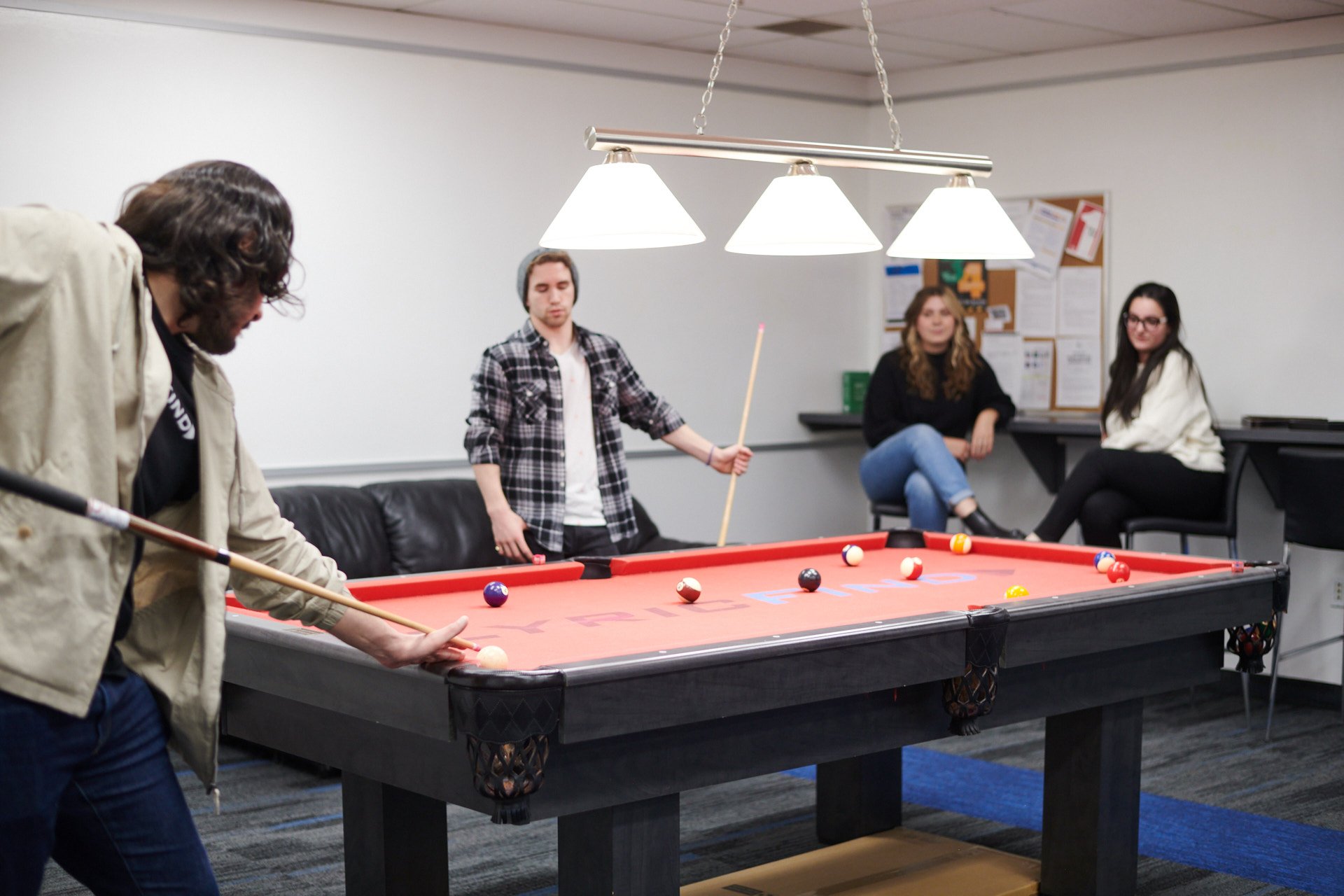 LyricFind employees playing pool